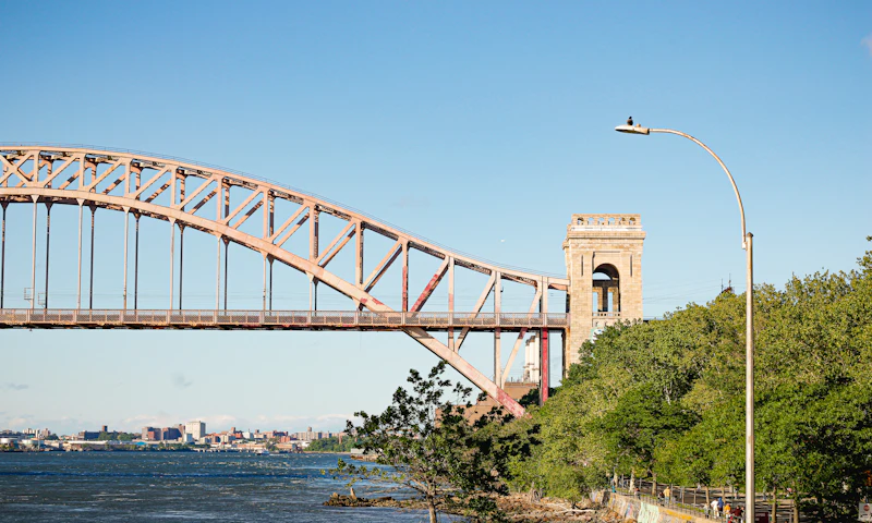 The Hell Gate Bridge over the East River beside Astoria Park